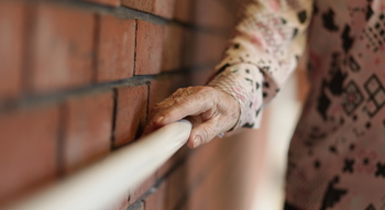 Lady holding onto a hand rail
