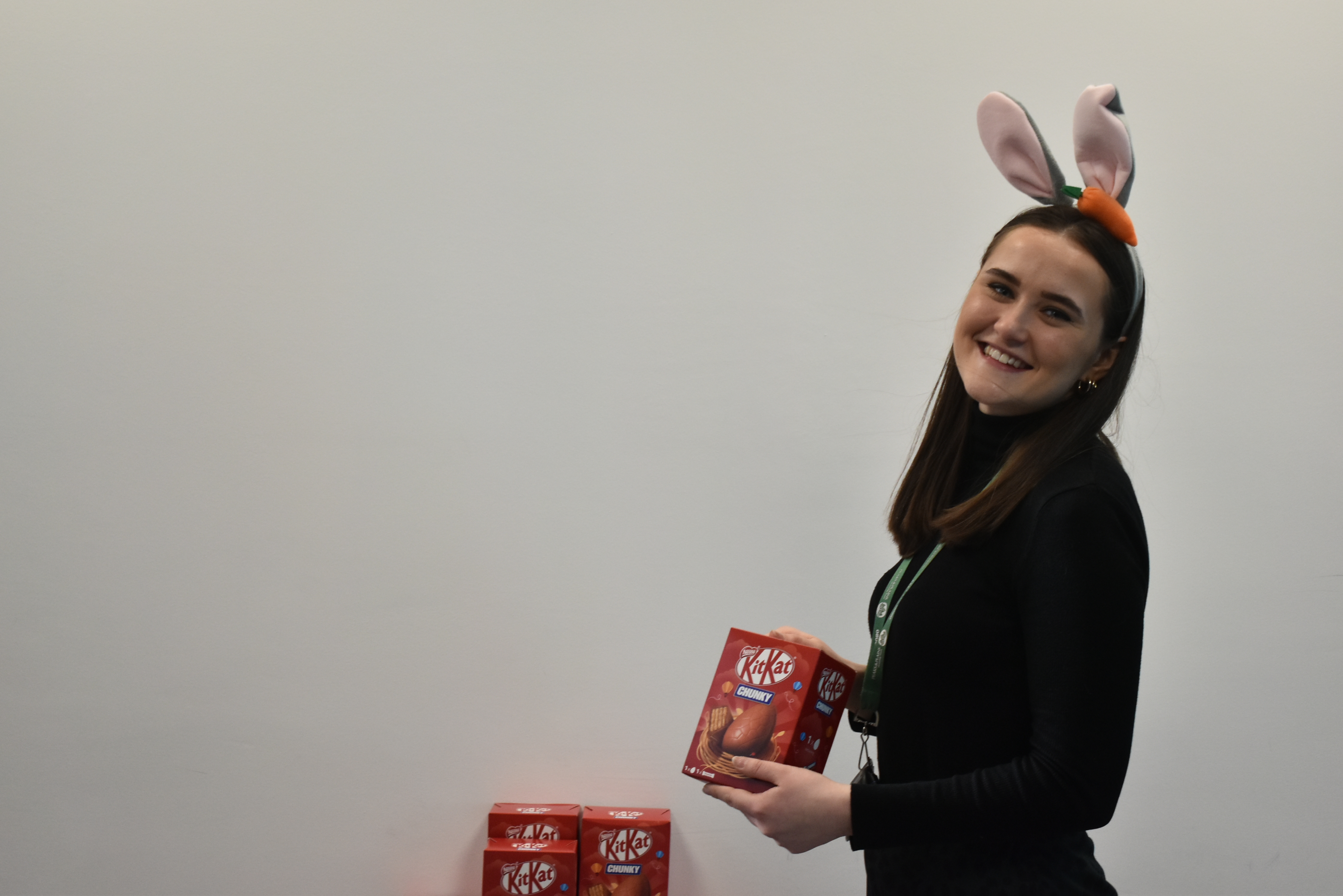Rachel, our Customer Voice Manager, posing with the Easter eggs that were donated for our Easter event. This is a yearly event that Rachel organises for our customers.