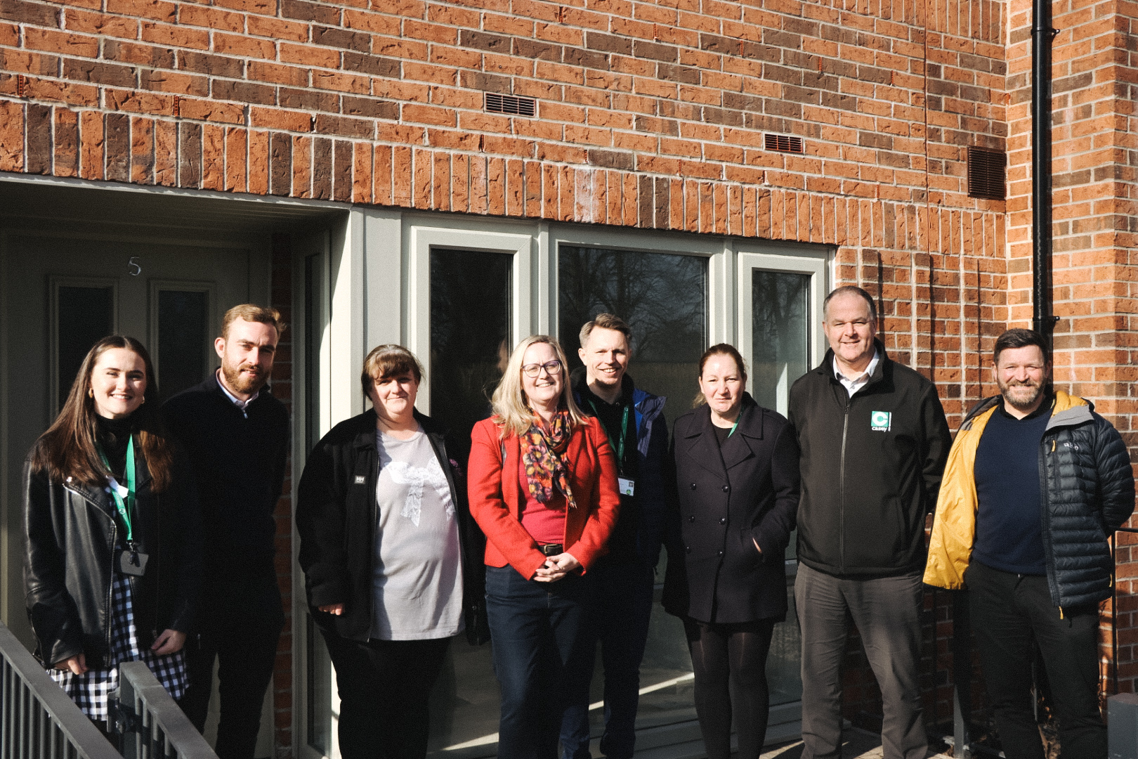 Group of people outside Emmeline Court