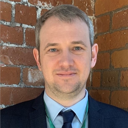 Simon, our Director of Operations is smiling at the camera.